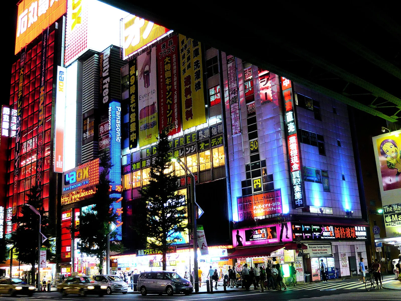 Neon-signed electronics and anime shops stacked along Akihabara's Chuo-dori street at night