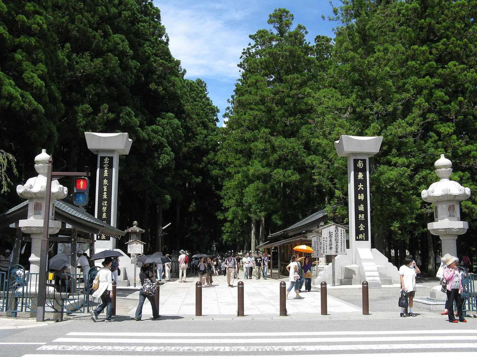 Okunoin's cedar-lined approach with rows of centuries-old moss-covered stone lanterns