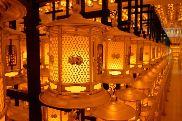 Thousands of lanterns glowing in the dim lantern hall of Okunoin temple on Mount Koya