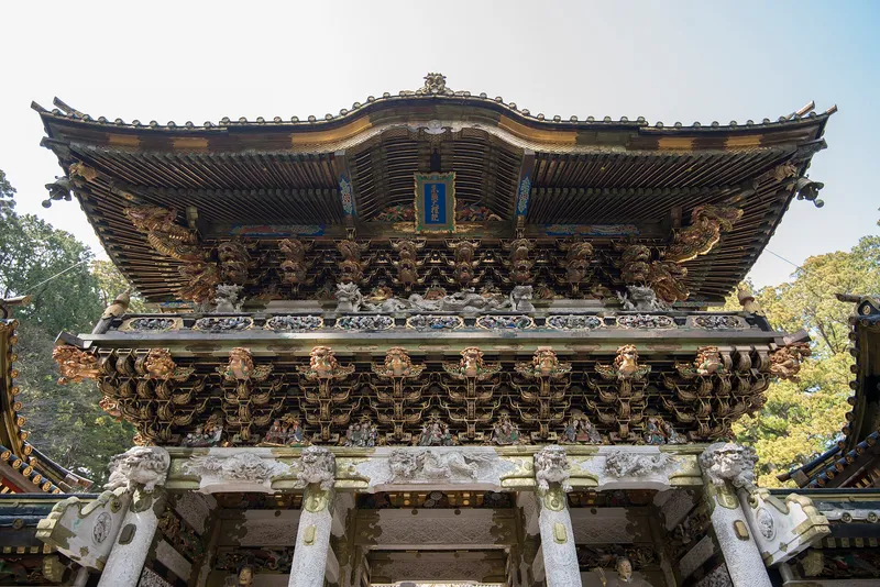 Ornately carved Yomeimon gate of Toshogu Shrine in Nikko with gold detail