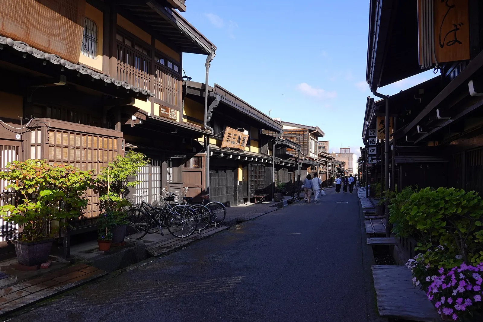 Sanmachi old town's dark wooden merchant houses along the Miyagawa River